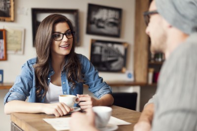 Woman in White Shirt Beside Teacup